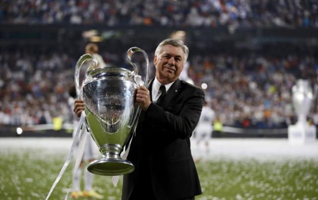 446836-real-madrids-coach-carlo-ancelotti-poses-with-the-champions-league-tro-1413406094.jpg