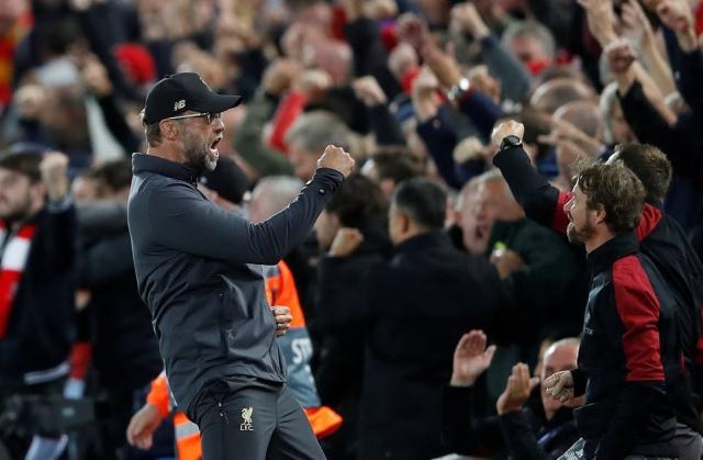 klopp_turns_to_celebrate_with_supporter-a-14_1537306506710