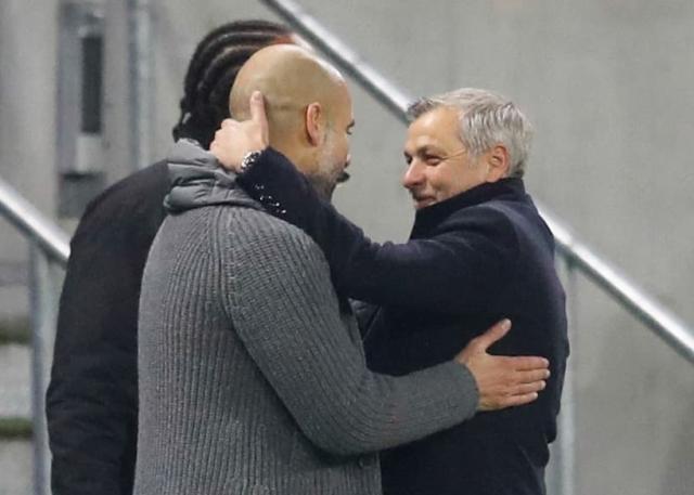 Pep-Guardiola-et-Bruno-Genesio-lors-de-OL-Manchester-City-en-2018-1721938.jpg