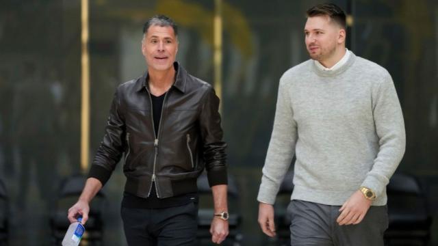 los_angeles_lakers_luka_doncic_right_walks_to_the_podium_with_general_manger_rob_pelinka_a49c4b01f20c19b6cc1d0b1b109d51f3.jpg